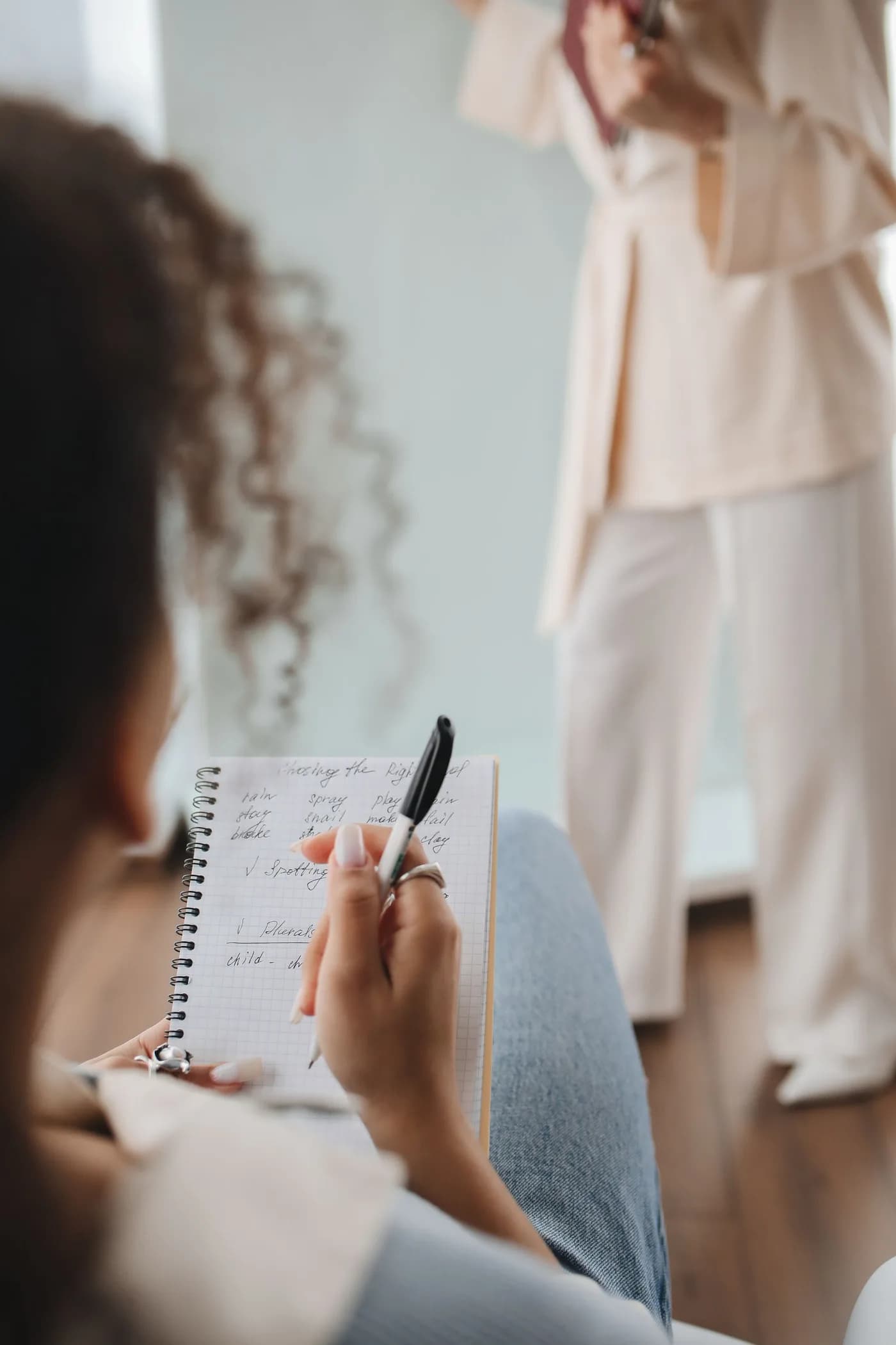 Student writing notes during a language class